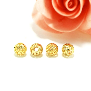 Detail of four 18k gold hollow mesh spacer beads for DIY jewelry making accessories