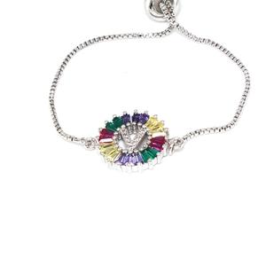 Detail of adjustable silver bracelet with colorful zircon V-letter pendant charm