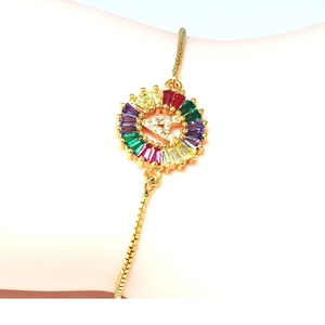 Close-up of golden adjustable bracelet with rainbow zircon A letter pendant on wrist