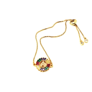 Detail of gold box chain bracelet with multi-color crystal letter A zircon pendant