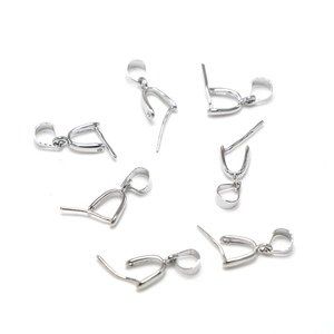 Detailed macro view of seven silver-plated jewelry pinch bails for DIY pendant necklaces