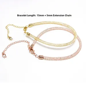 Detail of mesh braided bracelet in gold and rose gold with adjustable lobster clasp