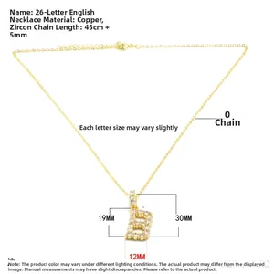 Detailed view of gold letter B pendant with white zircon inlays and copper 0-chain