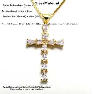 Close-up of golden cross necklace with teardrop zircons, 45cm chain and 32x20mm pendant