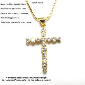 Detailed close-up of a gold-plated cross necklace with micro-paved cubic zirconia stones