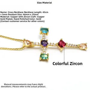 Detailed macro view of gold plated cross pendant with vibrant multi colored zircon stones