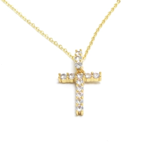 Close-up of gold cross pendant necklace featuring brilliant white cubic zirconia stones