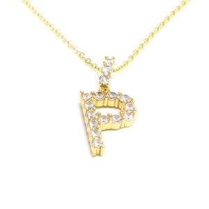 Detailed view of the gold letter P pendant with sparkling cubic zirconia pavé stones