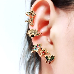 Bohemian gold ear cuff set with colorful stones featuring star moon and butterfly motifs