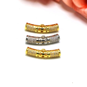 Macro view of gold and silver curved jewelry connectors with inlaid zircons for DIY designs