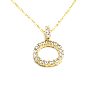 Detailed close-up of a gold necklace with a sparkling pavé crystal circle pendant