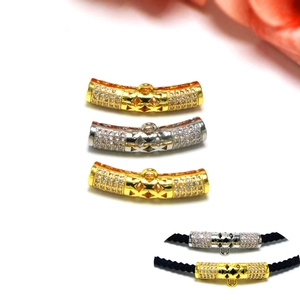 Detailed view of gold and silver plated tube sliders with micro-pave cubic zirconia crystals