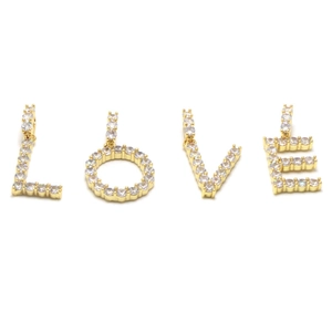 Close-up of gold-plated LOVE alphabet pendants encrusted with shimmering cubic zirconia