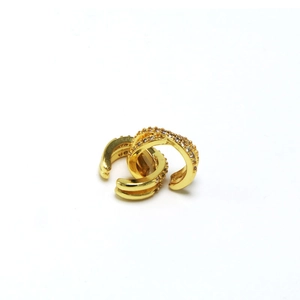 Detailed view of crisscross gold ear cuffs with white zircon micro-inlay finish