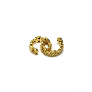 Detailed view of a gold chain link ear cuff with micro-pave sparkling crystals
