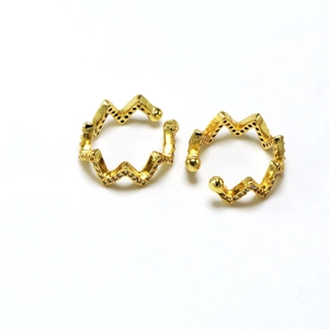 Close-up of golden zigzag ear cuff with sparkling pavé cubic zirconia details