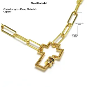 Detailed macro of gold chunky chain with colorful gemstone cross pendant and dimensions