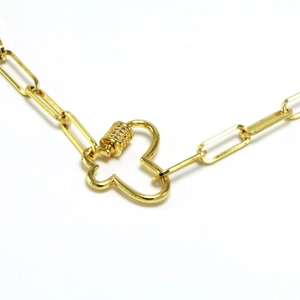 Detail of gold paperclip chain necklace with a unique heart-shaped spiral carabiner clasp
