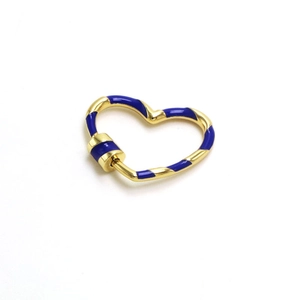 Close-up of heart-shaped gold screw clasp with dark blue enamel spiral pattern detail