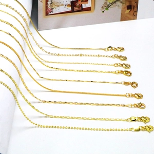 Detailed set of nine assorted gold-plated chains including snake, box, and bead styles