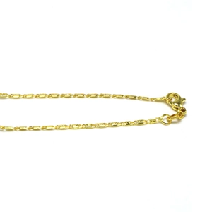 Close-up of golden box chain necklace featuring a secure lobster clasp and polished links