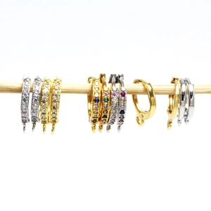 Detail of assorted DIY gold and silver earring hoop findings with zircon and pendant loops