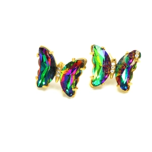 Detail of crystal butterfly earrings with rainbow faceted wings and gold accents
