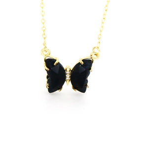 Chic butterfly pendant necklace featuring black faceted wings and golden chain
