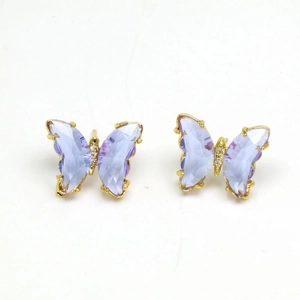Macro view of light purple crystal butterfly studs with gold metal and tiny rhinestones