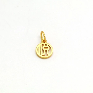 Detailed shot of a gold-plated round pendant with hollow design and Chinese Yue character
