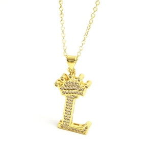 Detailed close-up of gold crown letter L pendant necklace with pavé zircon stones