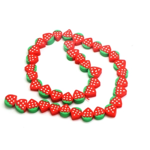 DIY strawberry polymer clay beads for handmade necklaces and bracelets with white background