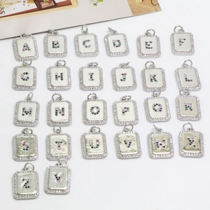 Set of 26 alphabet pearl necklaces with colorful zircon initials and silver metal finish