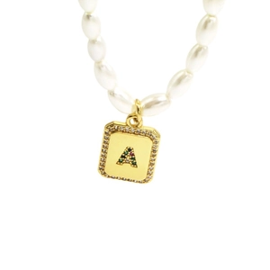 Elegant pearl necklace with a square gold pendant featuring letter A and colorful gemstones