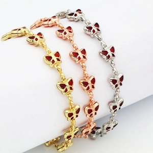Schmetterlingsarmband-Set in Gold, Roségold und Silber mit roten Emaille-Details