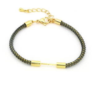 Detail of grey braided cord bracelet with gold lobster clasp and adjustable metal chain