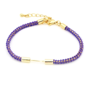 Detail of hand-woven purple and gold nylon bracelet with adjustable lobster clasp and chain
