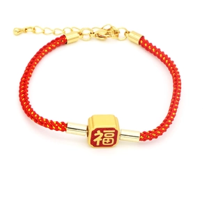 Detailed view of adjustable red nylon bracelet with a lucky Fu gold square pendant