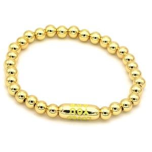 Detail of beaded gold bracelet featuring an engraved You Are Loved metal tube bead