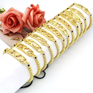 Set de pulseras de cuentas doradas con dijes de luna, estrellas y símbolos ojo turco