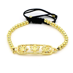 Pulsera de cuentas doradas con tres abejas de strass y cordón negro ajustable