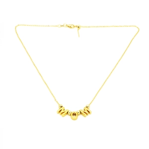 Macro detail of gold-plated MOM letter pendant necklace with clasp and chain extension
