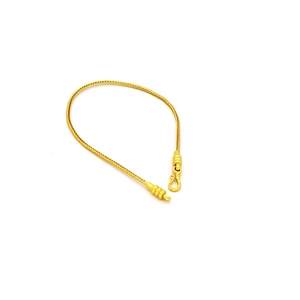 Bracciale elastico con catena a serpente dorata e corda rossa con filo d'acciaio a C e gancio S