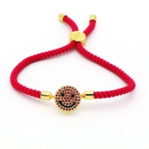 Pink bohemian woven rope bracelet with gold smiling face pendant and colorful zircon stones