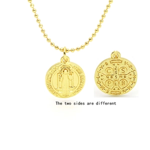 Close-up of double-sided Saint Benedict medal pendant with a gold bead chain