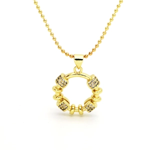 Detailed macro view of gold bead chain and circular pendant with white zircon crystals
