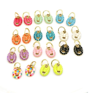 Detailed grid of colorful enamel pig nose earrings with gold-toned metal closures