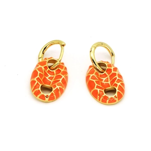 Detail of orange enamel pig nose earrings with gold-tone grid texture for women