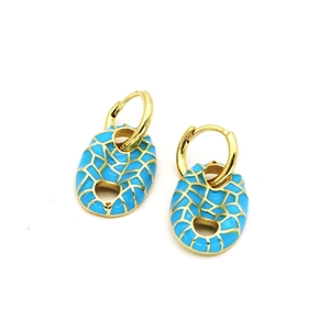 Detail of golden pig nose earrings with sky blue enamel and mosaic gold texture
