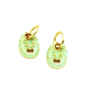 Detail of gold-framed mint green enamel pig nose earrings with mosaic texture pattern
